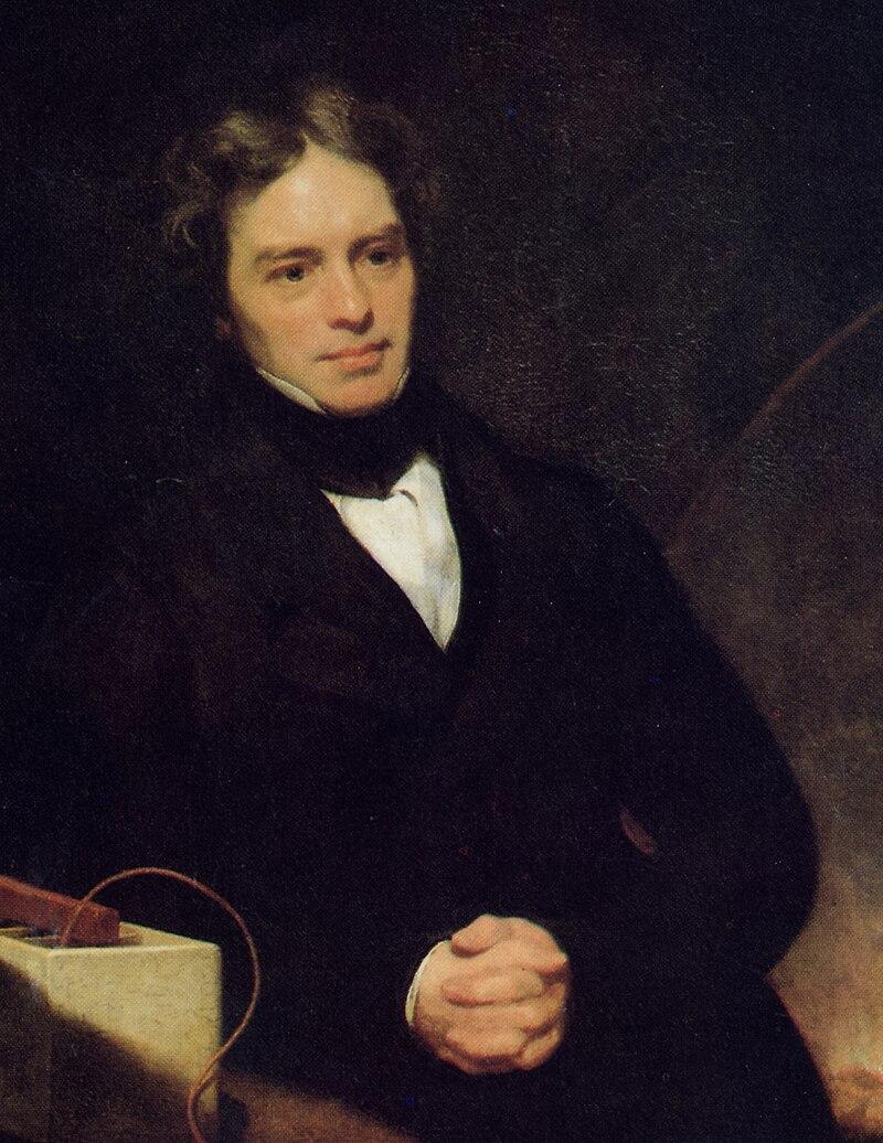 Michael Faraday by Thomas Phillips oil on canvas, 1841-1842.
Faraday wears formal black attire with a crisp white shirt. His expressive face, framed by wavy dark hair. Faraday’s gaze is direct yet thoughtful.
https://commons.wikimedia.org/wiki/File:M_Faraday_Th_Phillips_oil_1842.jpg#/media/File:M_Faraday_Th_Phillips_oil_1842.jpg Michael Faraday by Thomas Phillips oil on canvas, 1841-1842.
Faraday wears formal black attire with a crisp white shirt. His expressive face, framed by wavy dark hair. Faraday’s gaze is direct yet thoughtful.
https://commons.wikimedia.org/wiki/File:M_Faraday_Th_Phillips_oil_1842.jpg#/media/File:M_Faraday_Th_Phillips_oil_1842.jpg